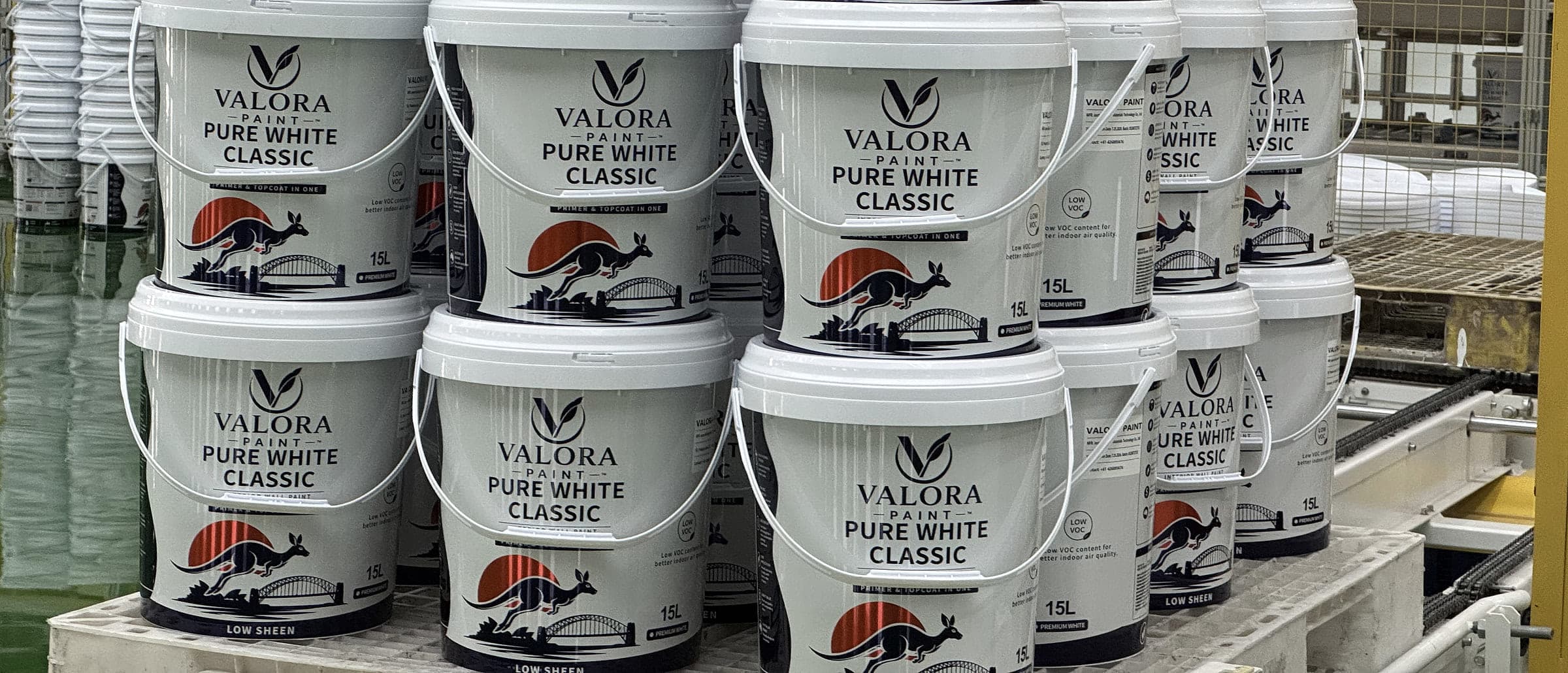 Stacked pails of VALORA PURE WHITE CLASSIC on the production floor